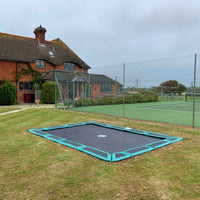 11ft x 8ft In-ground Trampoline in lawn Thumbnail