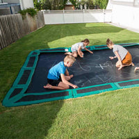 kids playing on sunken trampoline Thumbnail