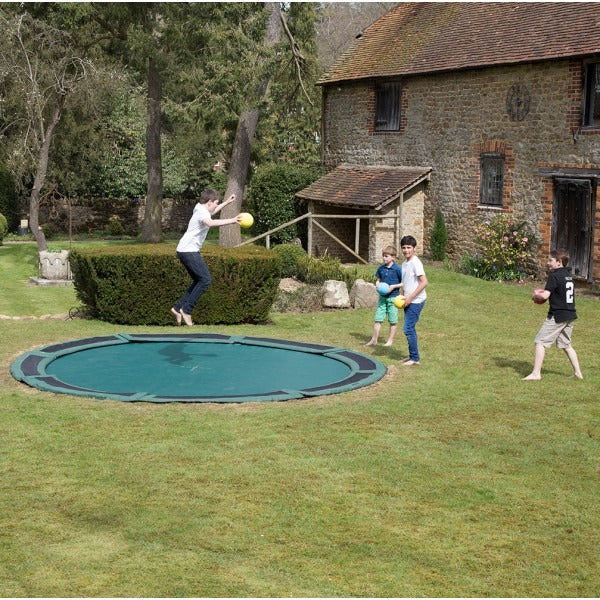 In-ground trampoline in garden