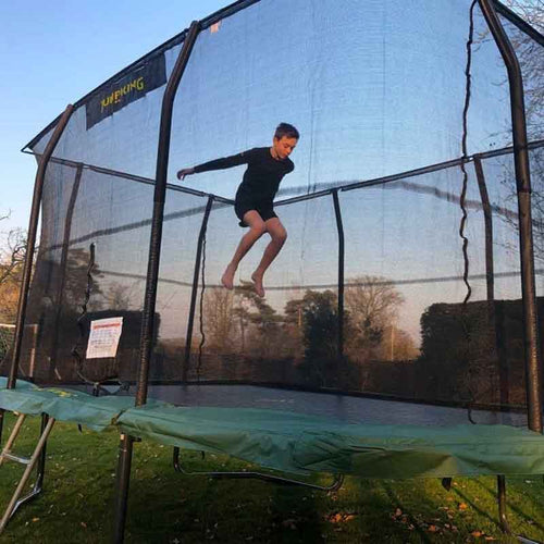 Boy jumping on Jumpking trampoline