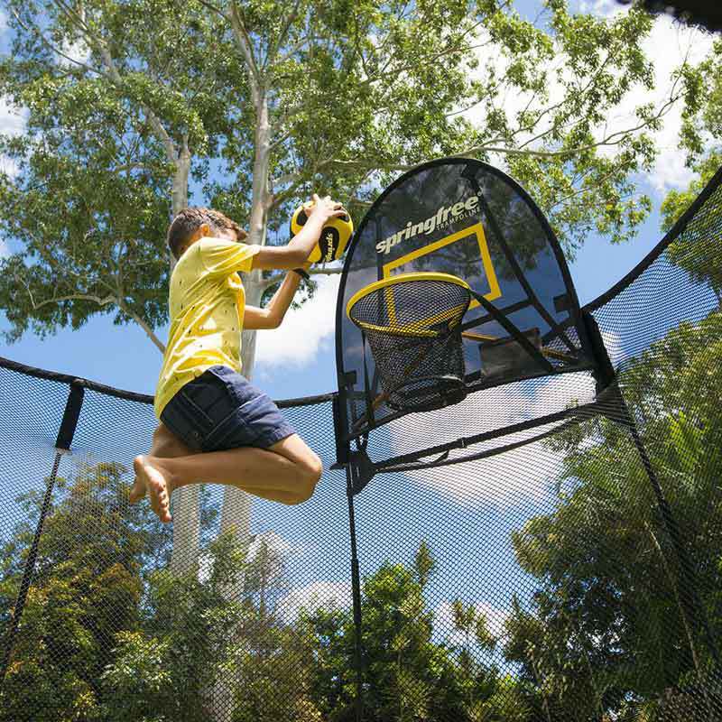 boy using Springfree FLEXR Basketball Hoop